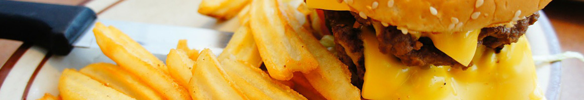 Eating Breakfast & Brunch Burger at Cue's Burgers restaurant in Houston, TX.